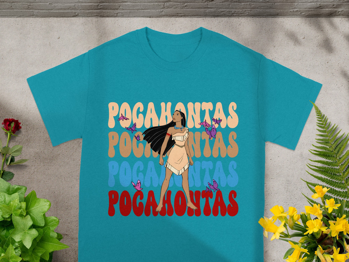 Teal t-shirt with "Pocahontas" in retro font and a stylized woman.