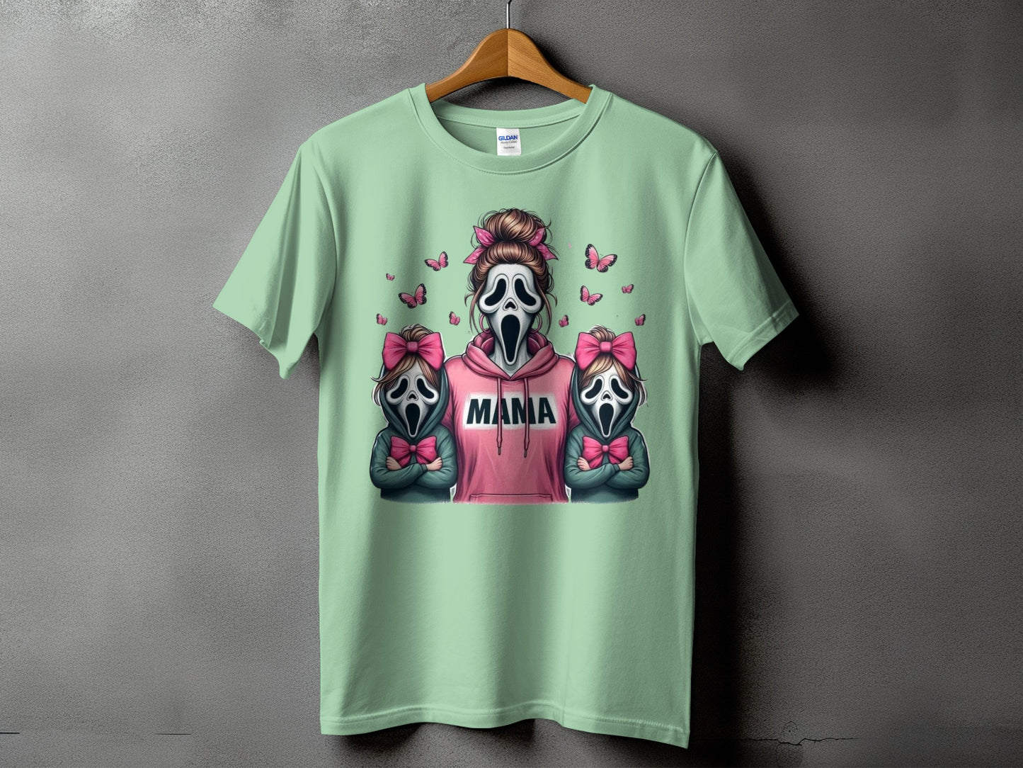 Ghostface mama and two children with pink bows and butterflies on mint green shirt.
