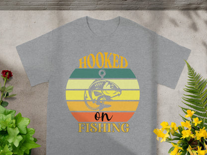 Grey t-shirt with "HOOKED on FISHING" text and a fish graphic.