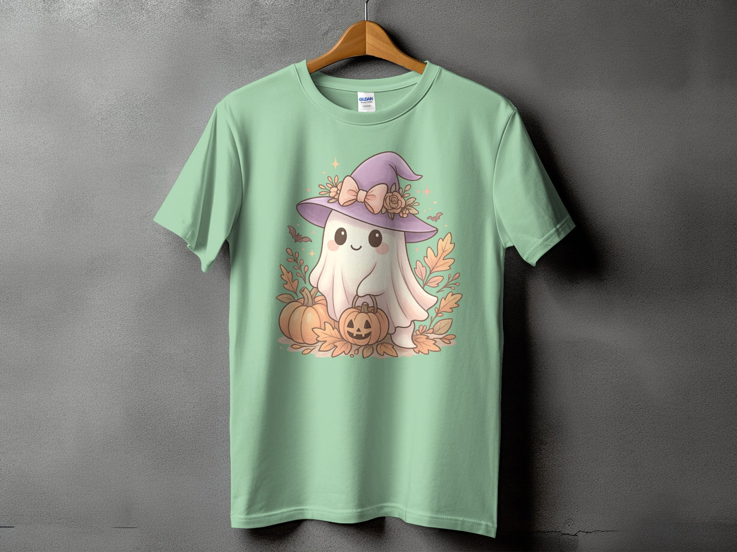 Cute ghost with witch hat, holding pumpkins and surrounded by leaves.