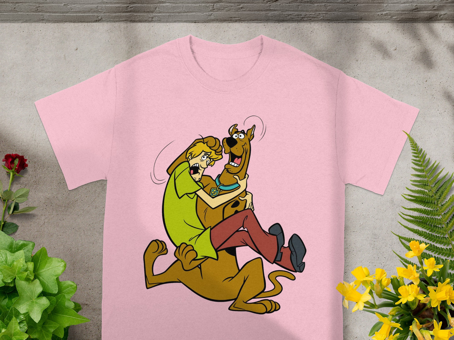 Scooby-Doo and Shaggy embrace on a Scooby-Doo and Shaggy graphic t-shirt.