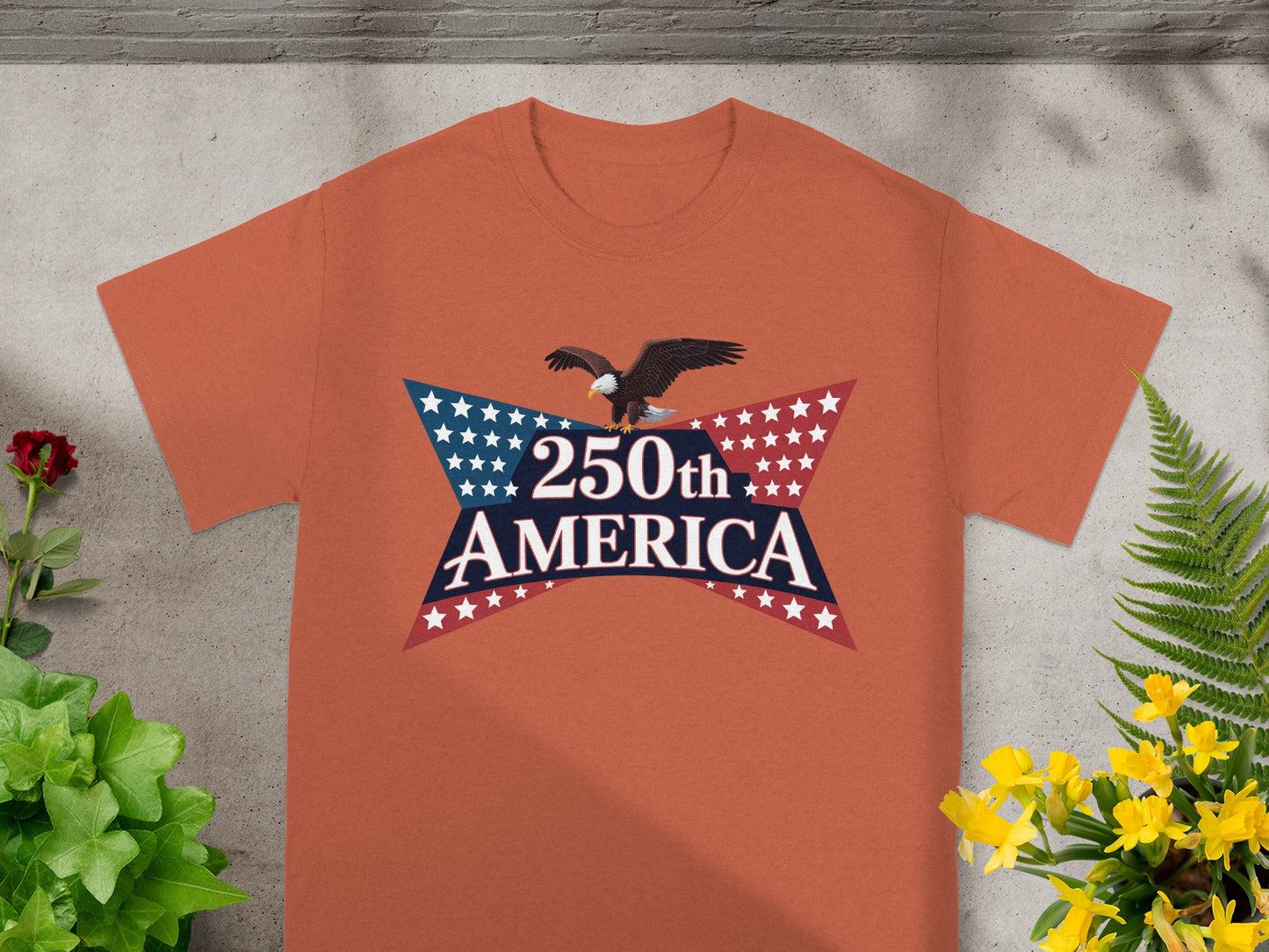 Orange t-shirt with a patriotic "250th America" graphic featuring an eagle.