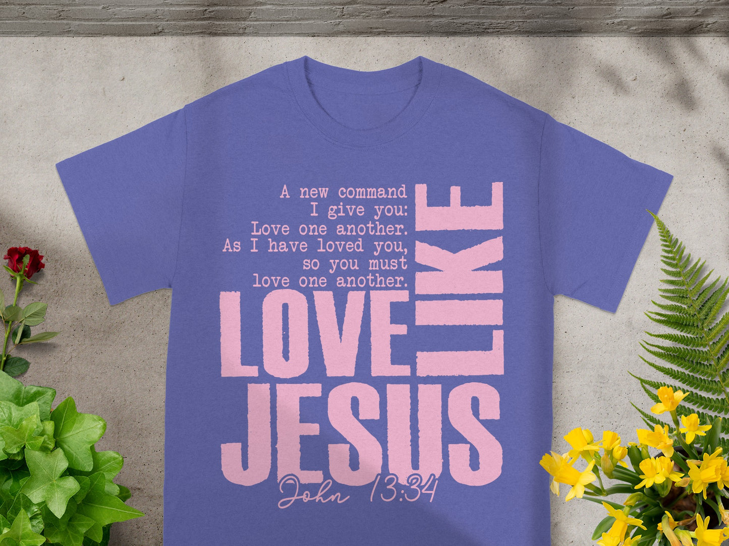 Purple t-shirt with pink text: "Love Jesus" and bible verse John 13:34.