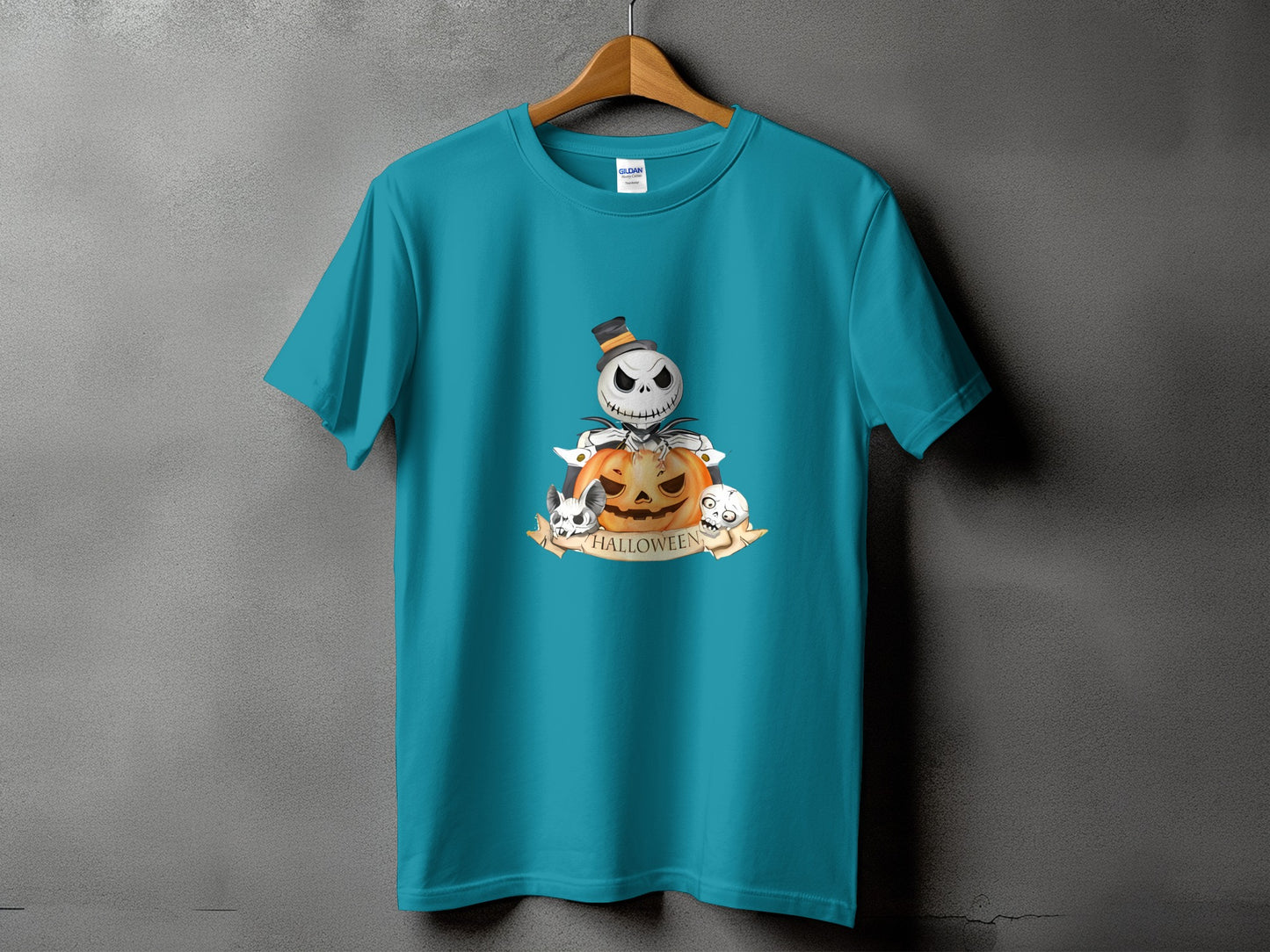 Teal t-shirt with Halloween graphic featuring a skeleton, pumpkin, and skulls.