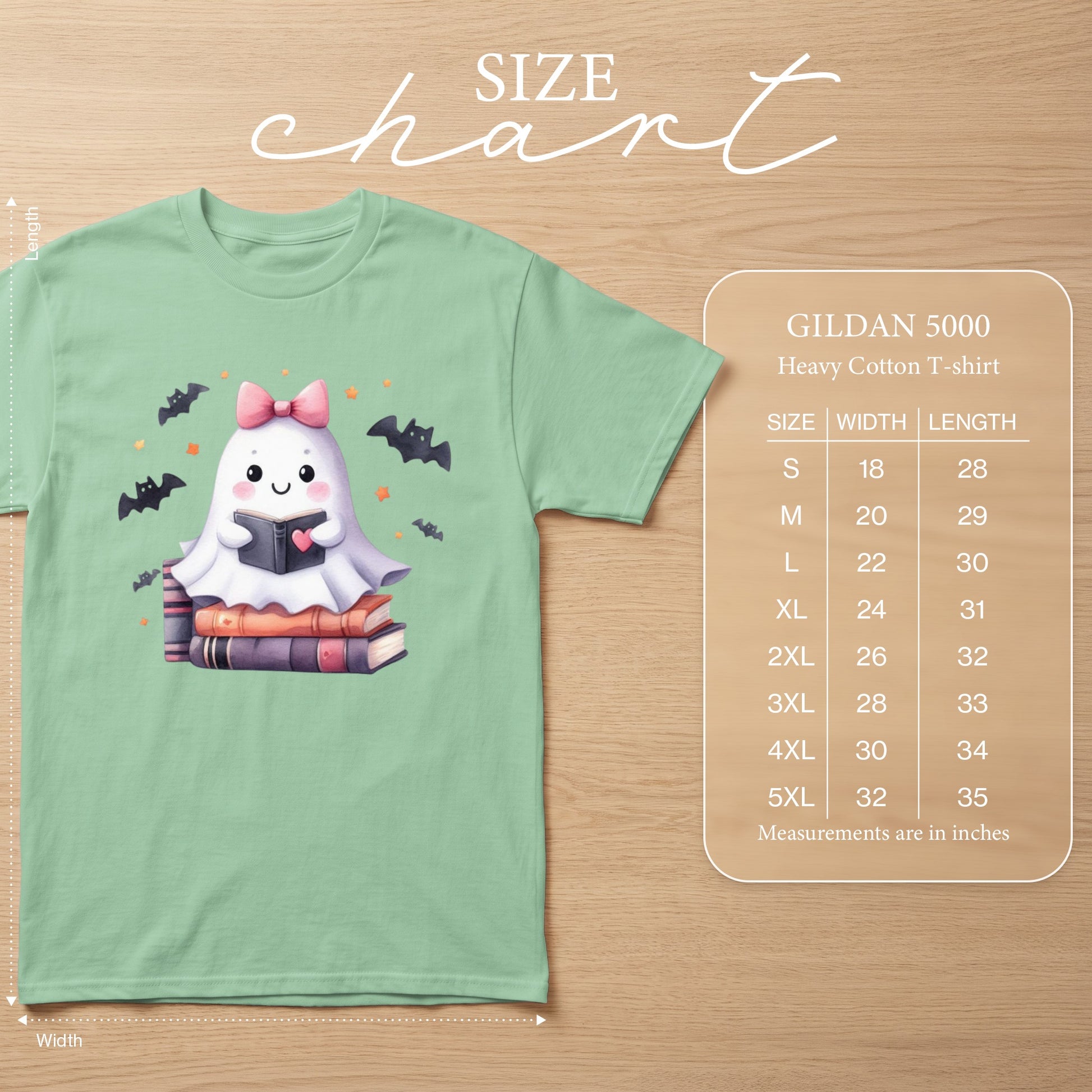 Light green t-shirt with cute ghost reading books graphic and size chart.