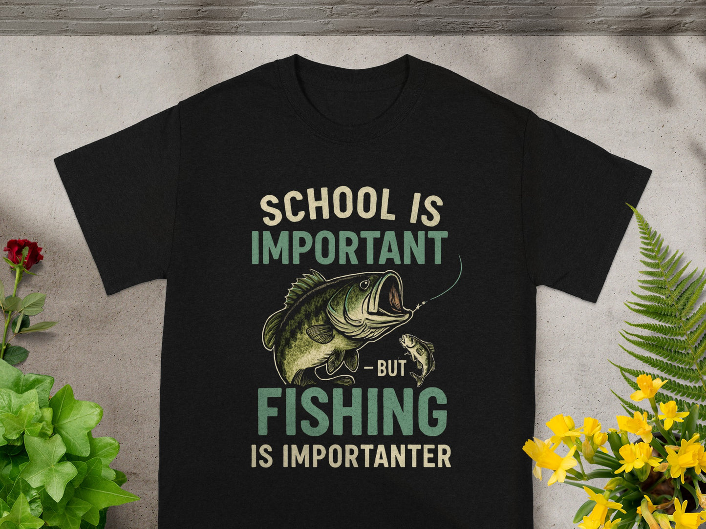 Black t-shirt with "School is important - but fishing is importanter" text and fish graphic.
