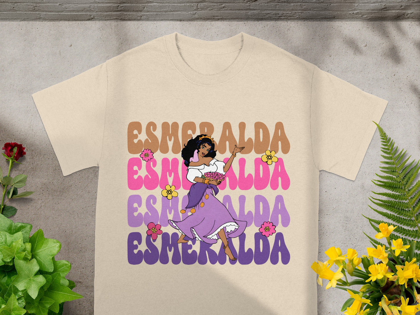 T-shirt with Esmeralda illustration and text in pastel colors.
