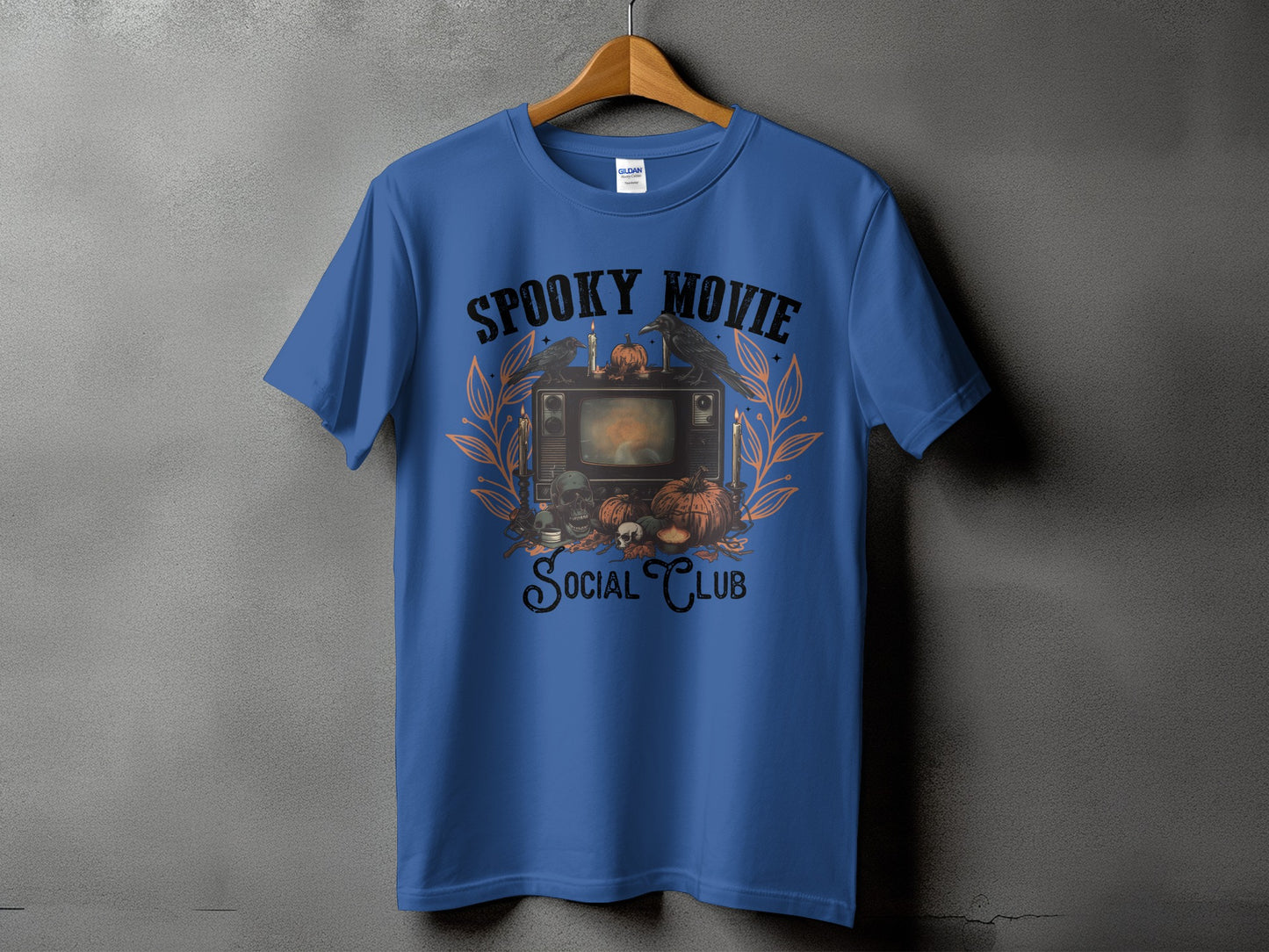 Blue t-shirt with "Spooky Movie Social Club" text and Halloween graphics.
