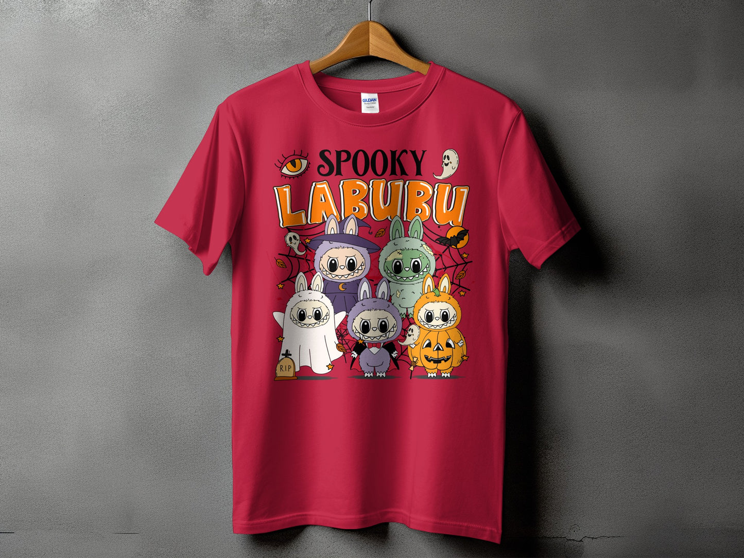 Red t-shirt with "Spooky Labubu" Halloween design featuring cartoon characters in costumes.