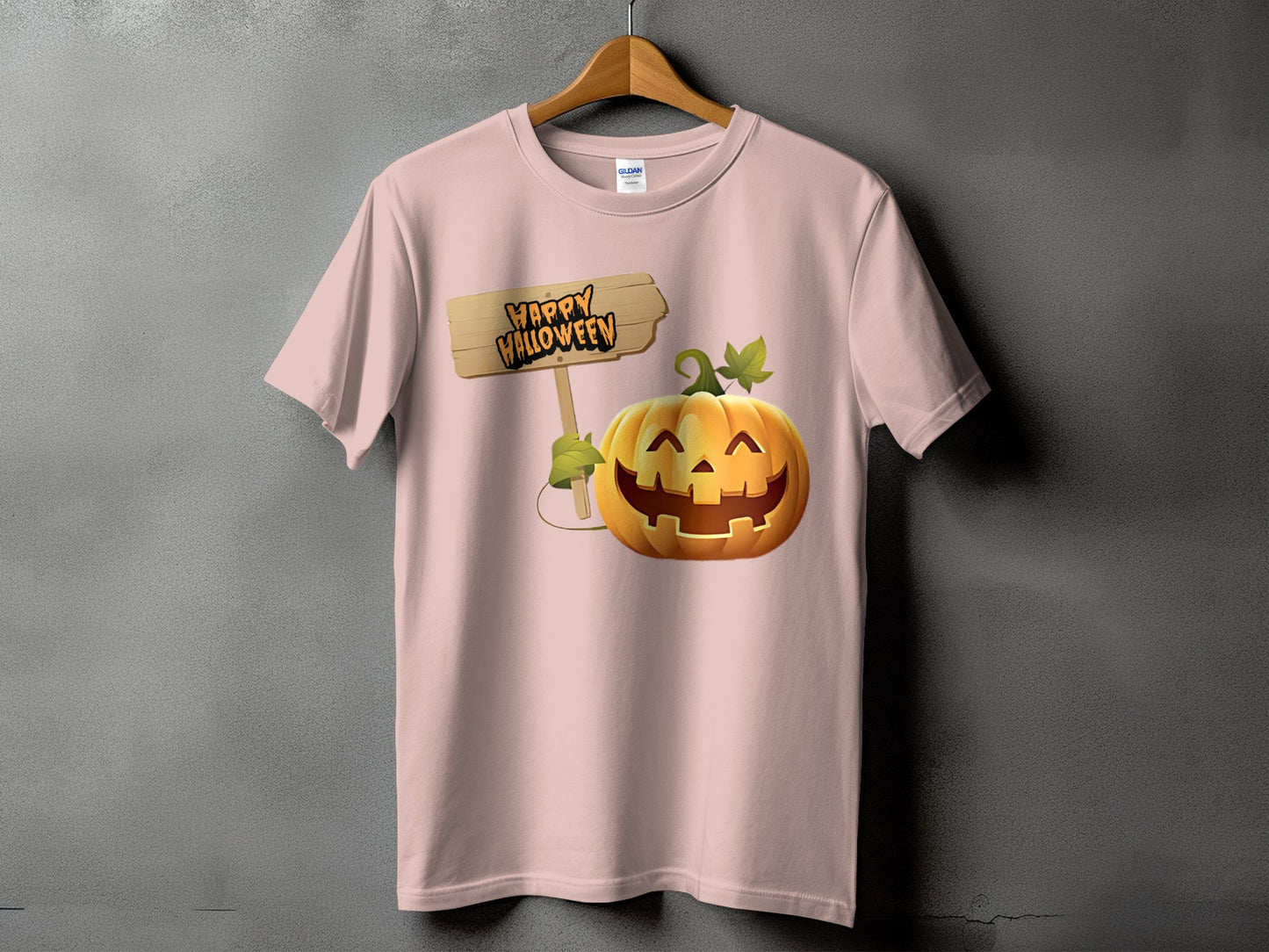 Pink t-shirt with a graphic of a grinning jack-o'-lantern holding a "Happy Halloween" sign.