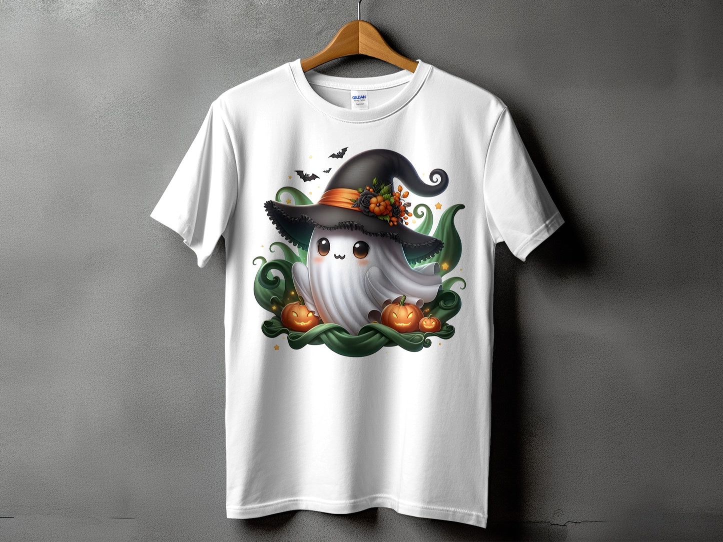 White t-shirt with a cute ghost wearing a witch hat and surrounded by pumpkins.