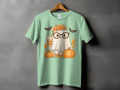 Mint green t-shirt with a cute ghost wearing glasses, holding coffee, with pumpkins and bats.