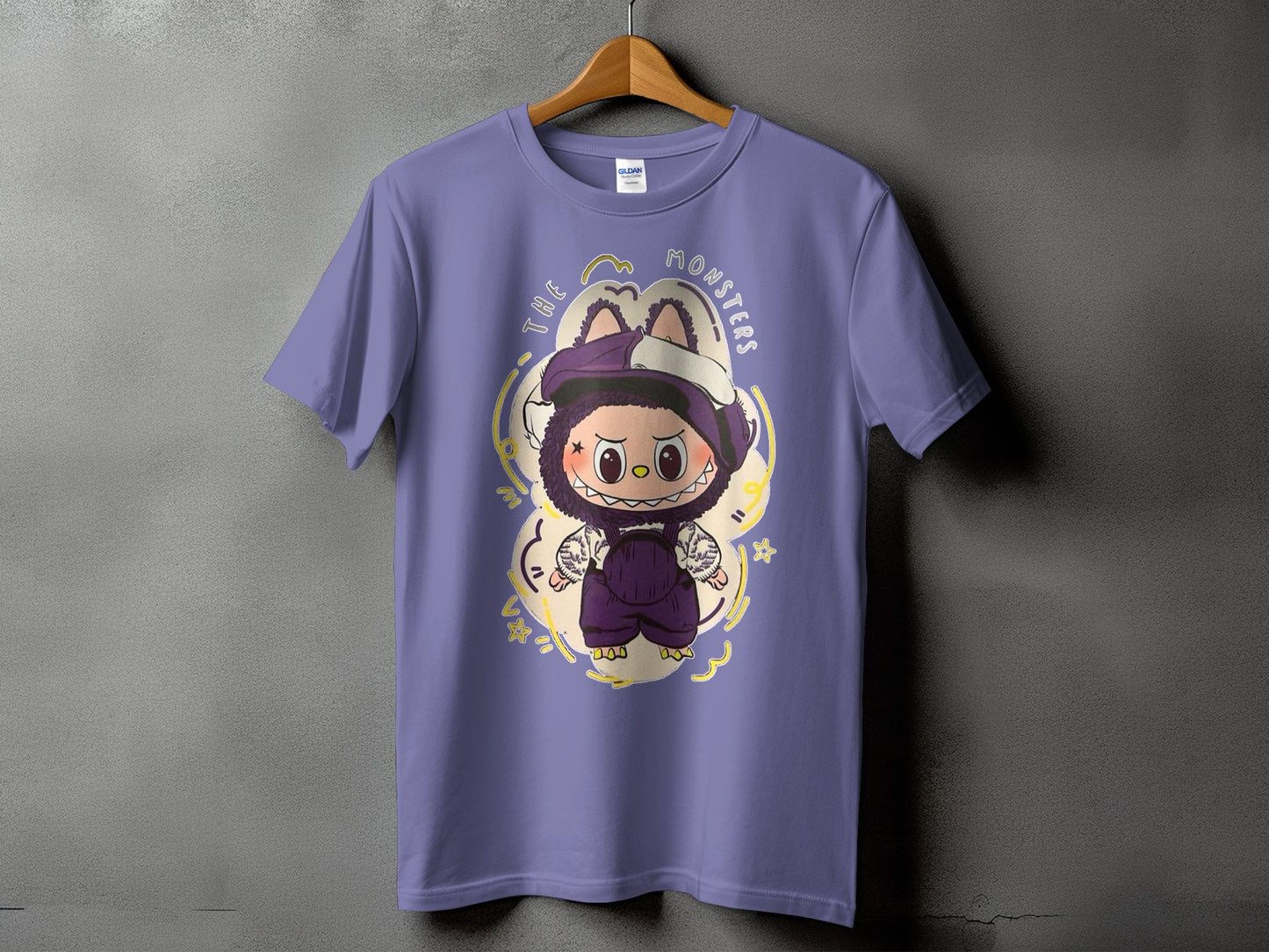 Purple t-shirt with a cartoon monster design and text "THE MONSTERS."