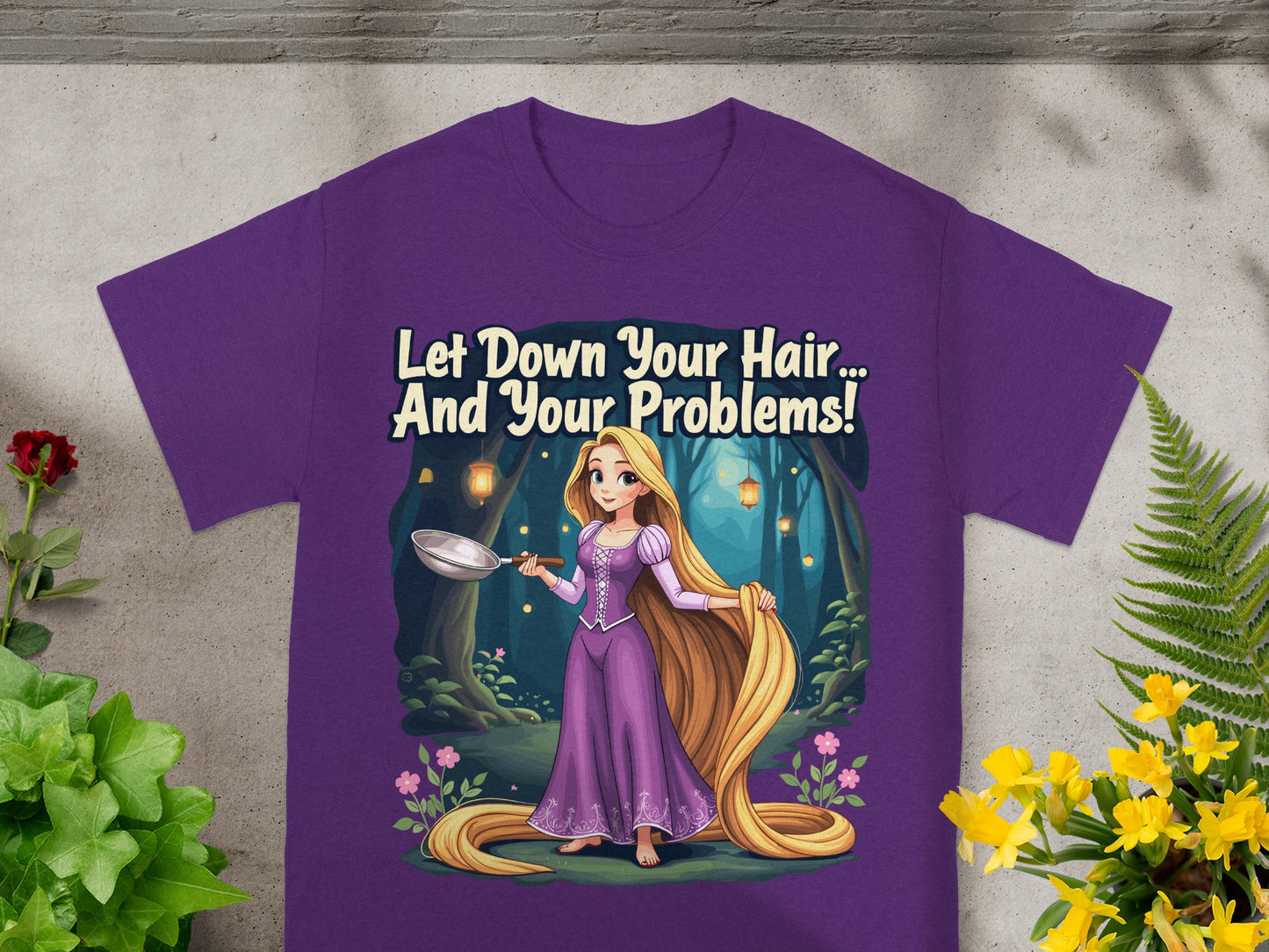 Purple t-shirt with Rapunzel holding a frying pan, saying "Let Down Your Hair... And Your Problems!"