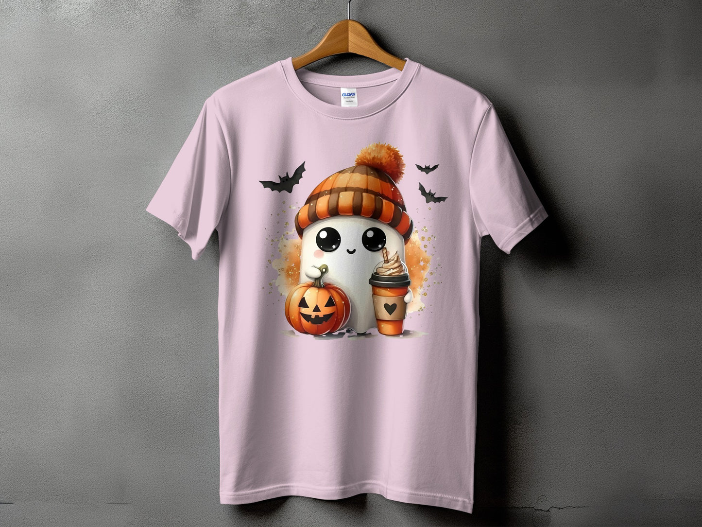 Pink t-shirt with ghost, pumpkin, coffee, and bats Halloween graphic.