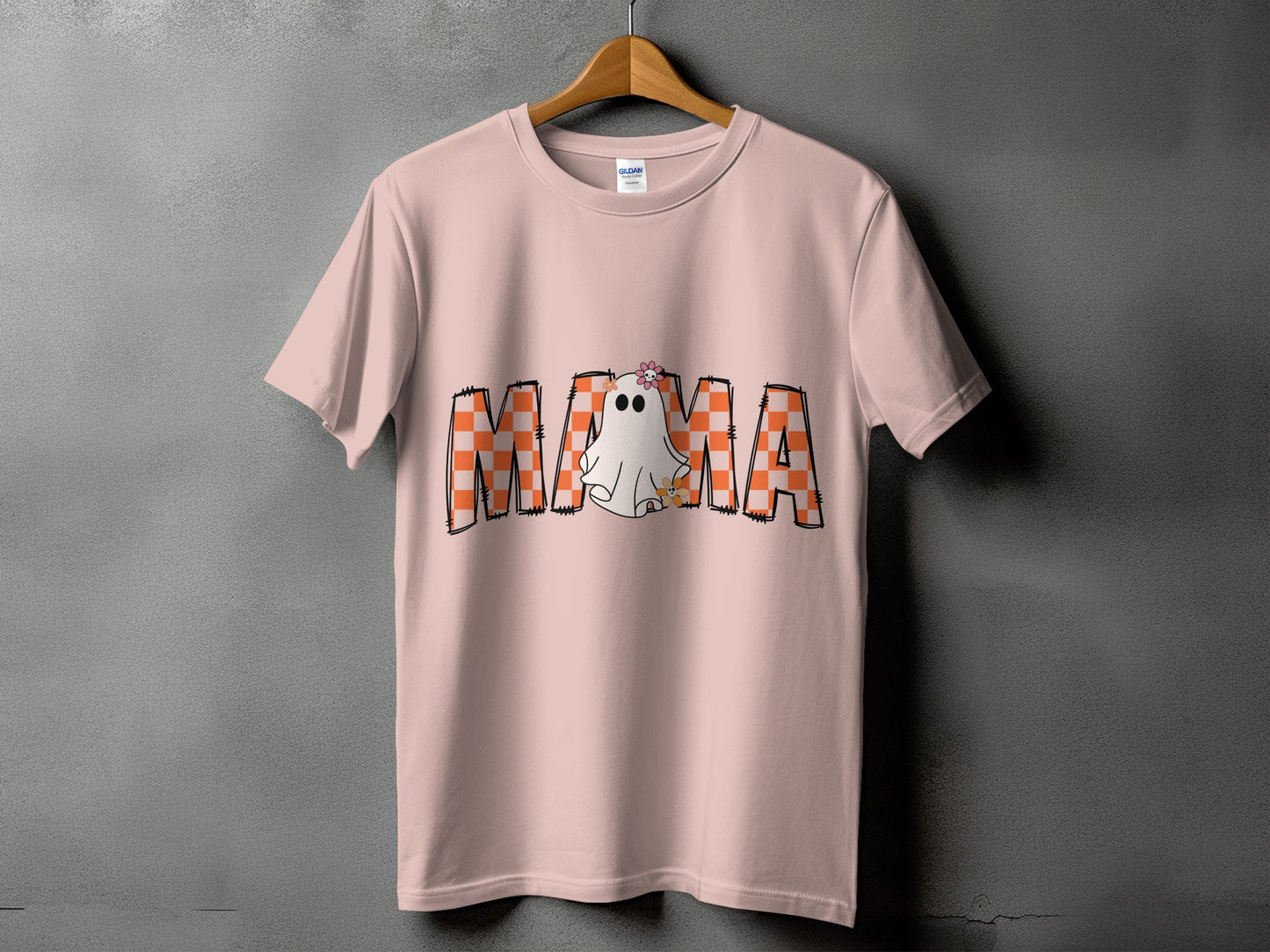Pink t-shirt with "MAMA" text featuring a ghost and checkered pattern.