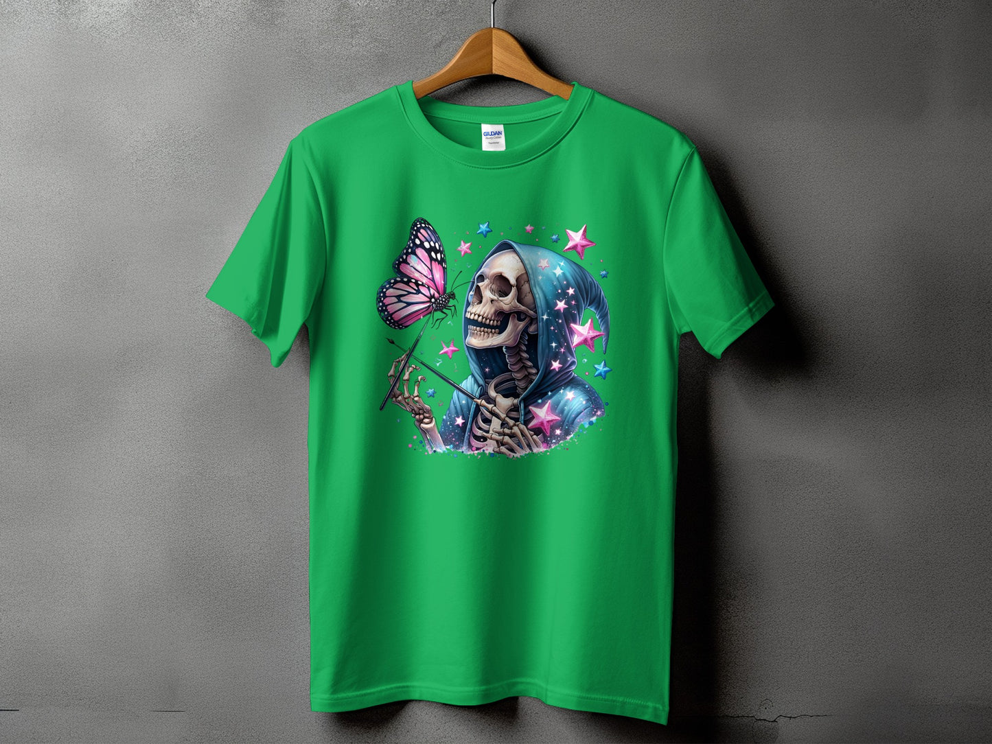 Green t-shirt with skeleton in a starry hooded robe holding a butterfly.