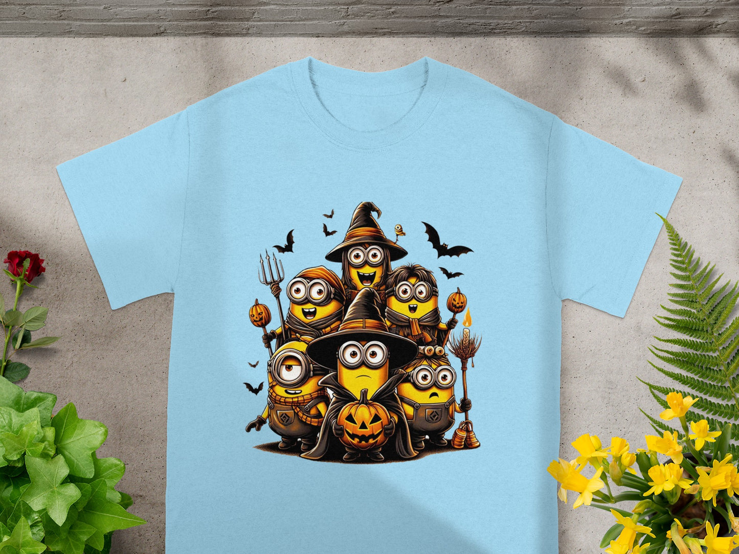 Minions in Halloween costumes holding pumpkins and broomsticks with bats.