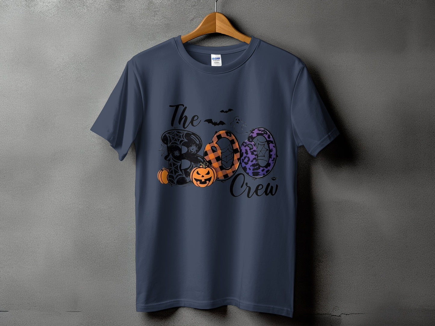 Navy t-shirt with "The BOO Crew" Halloween graphic and pumpkins.