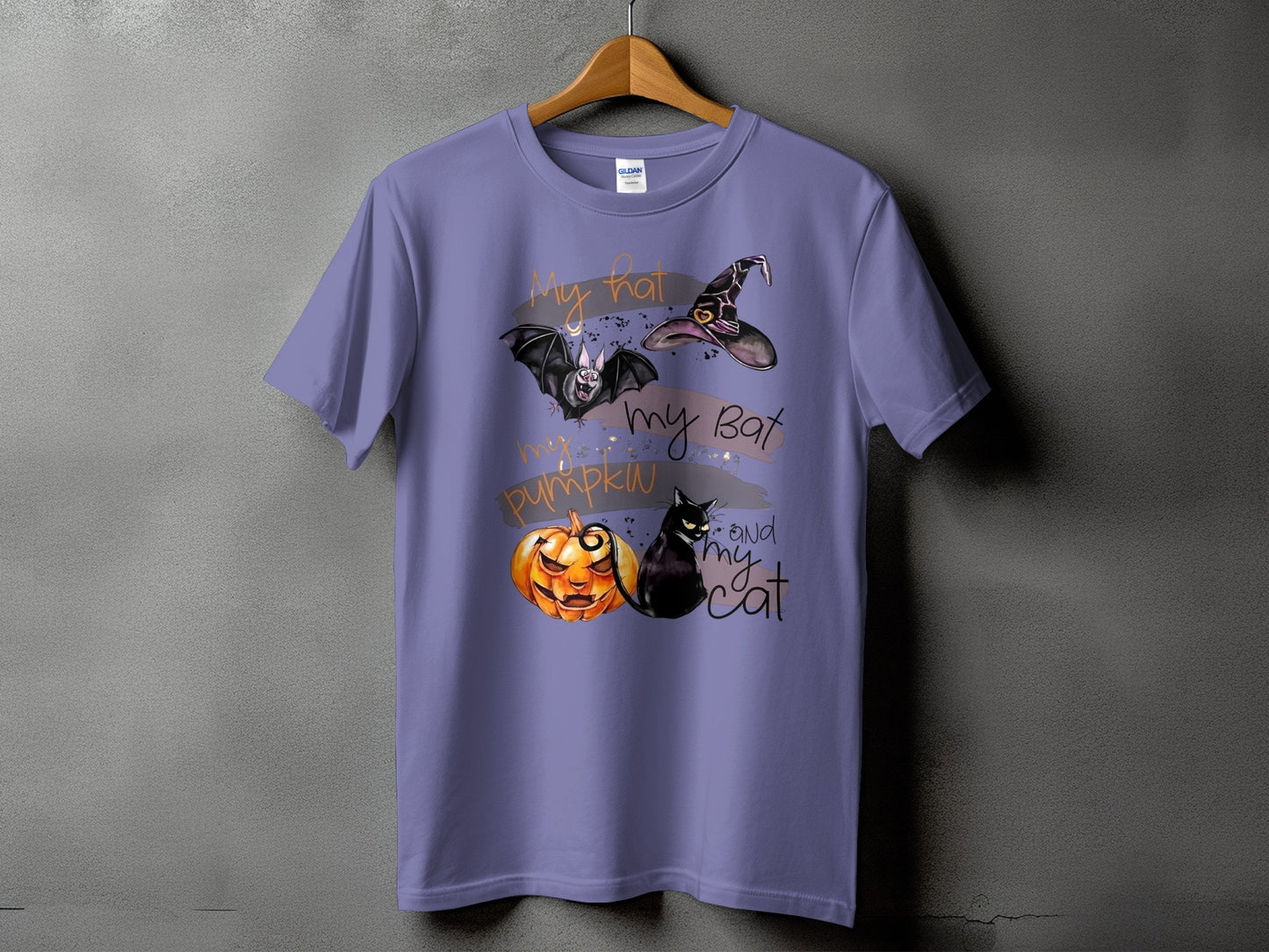 Purple t-shirt with "My hat, my bat, my pumpkin and my cat" Halloween graphic.