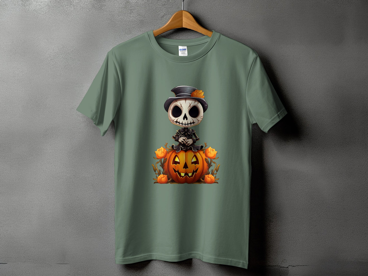Green t-shirt featuring a cartoon skeleton in a hat sitting on a pumpkin.