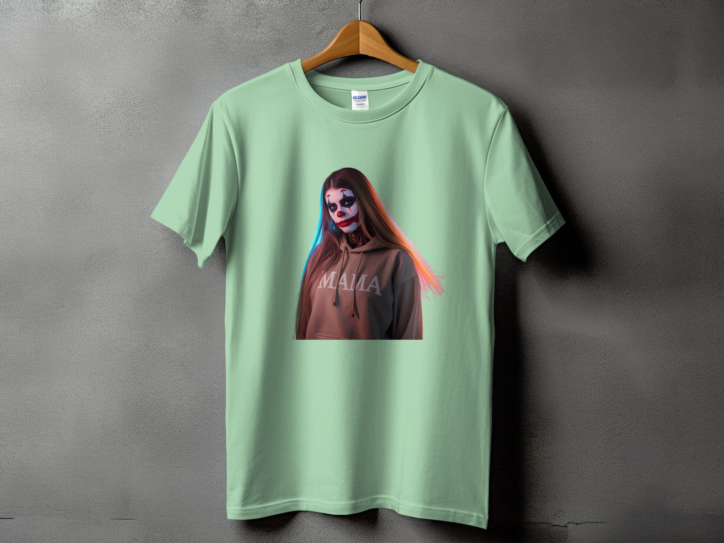 Light green t-shirt with a graphic of a woman in clown makeup and a hoodie that says "Mama".