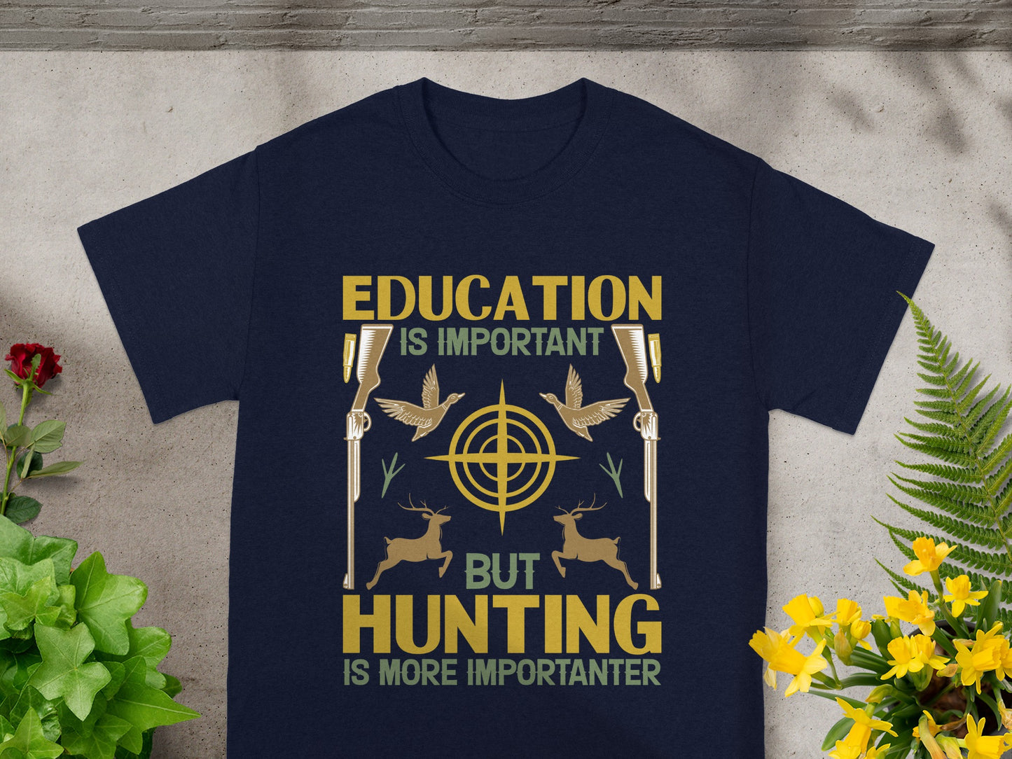 Navy t-shirt with "Education is important, but hunting is more importanter" text and hunting graphics.