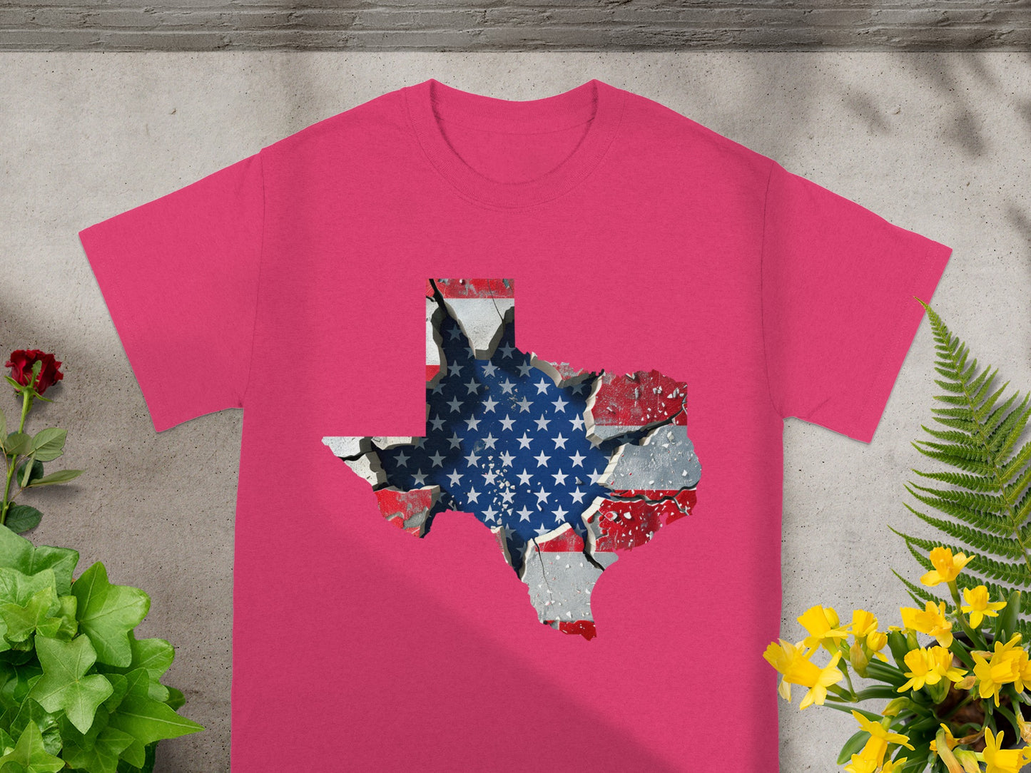 Pink t-shirt with a cracked Texas outline filled with the American flag design.