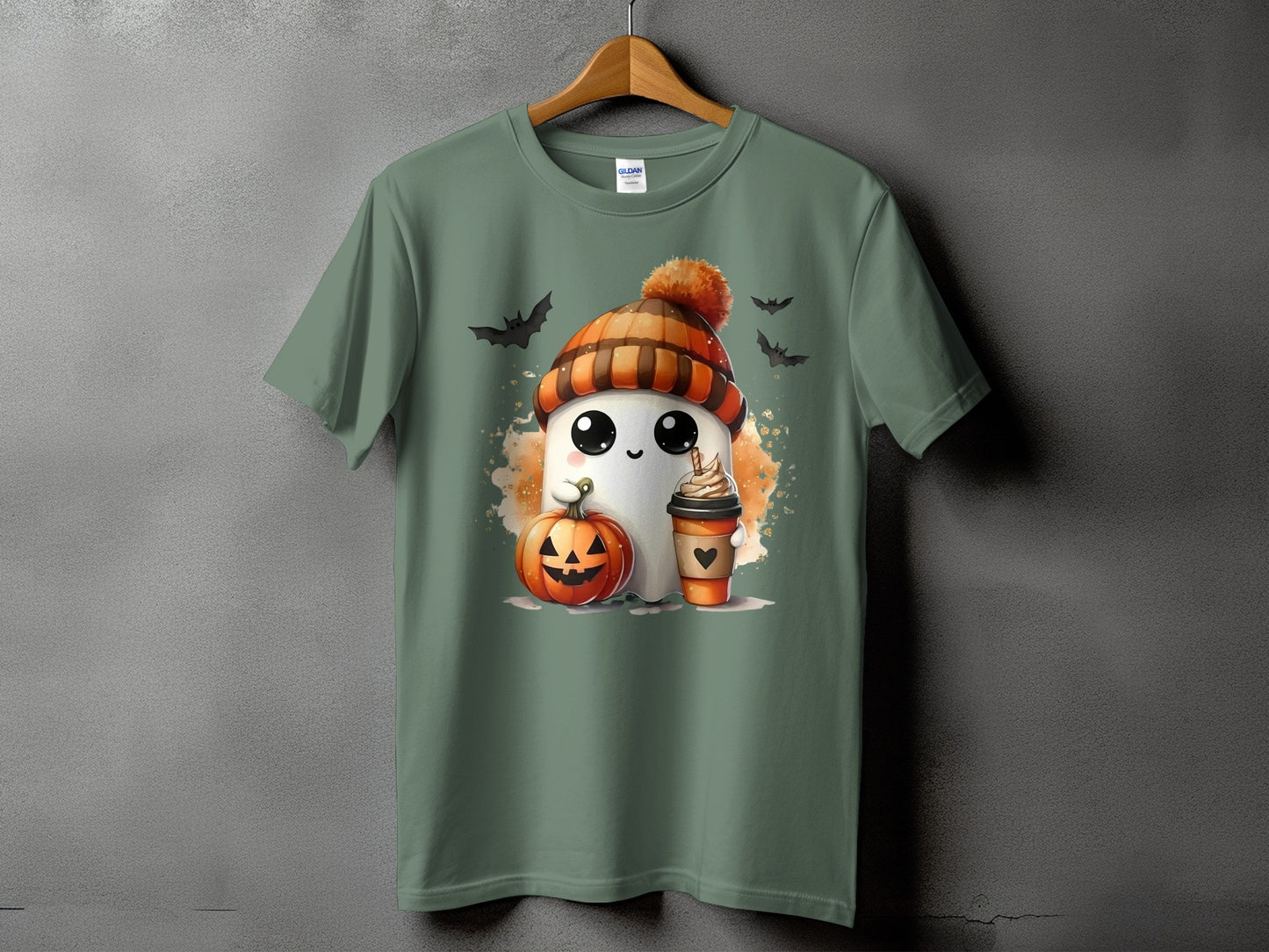 Green t-shirt with a cute ghost wearing a beanie, holding a pumpkin and coffee.