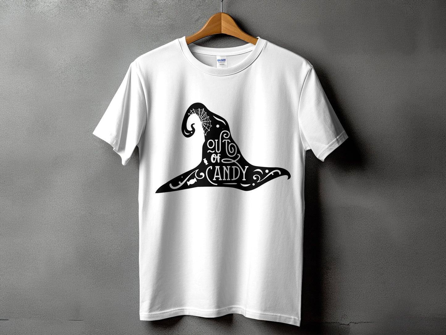 White t-shirt with a black witch hat graphic and text reading "out of CANDY".