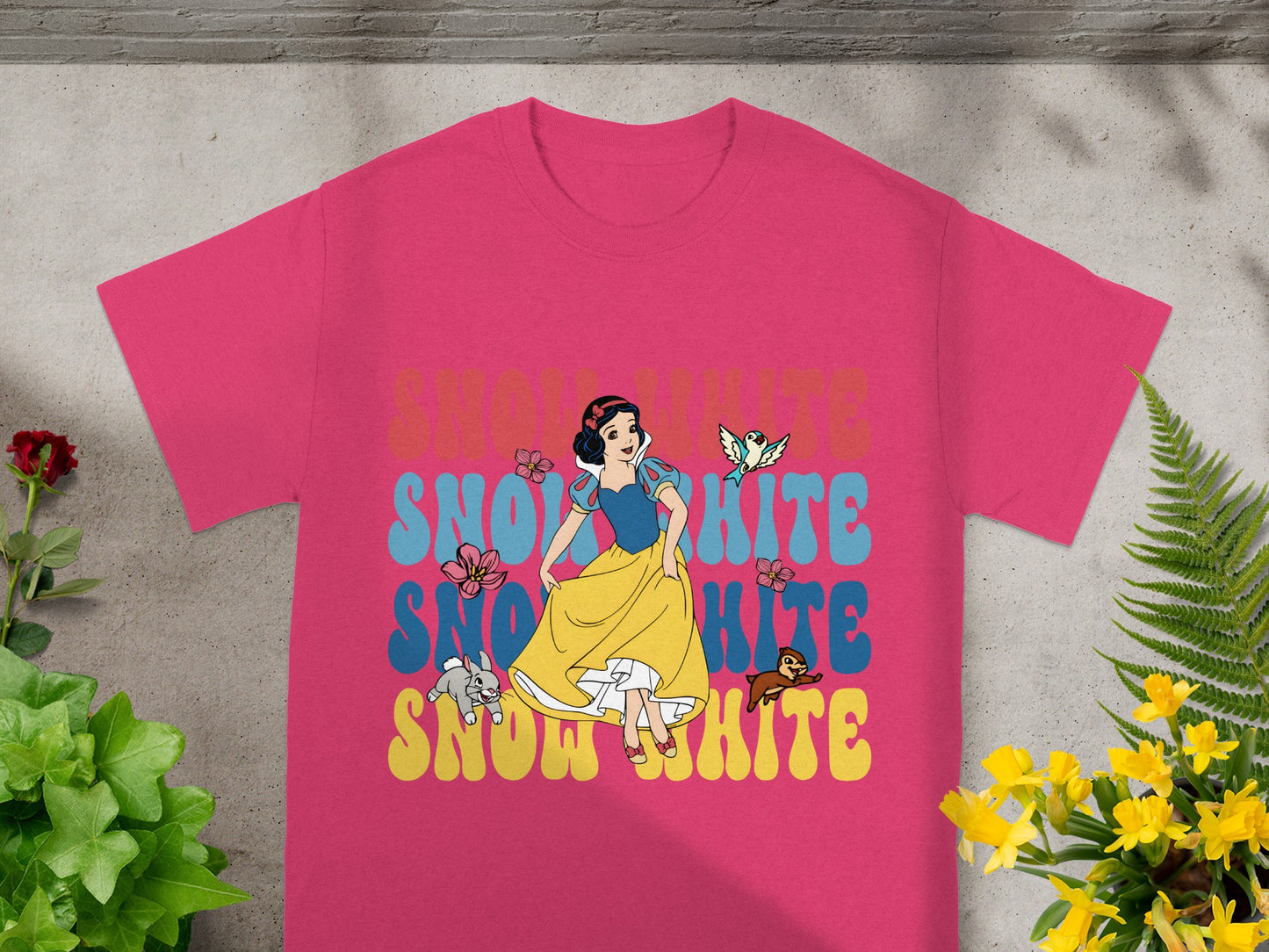 Pink t-shirt with Snow White graphic and colorful text.