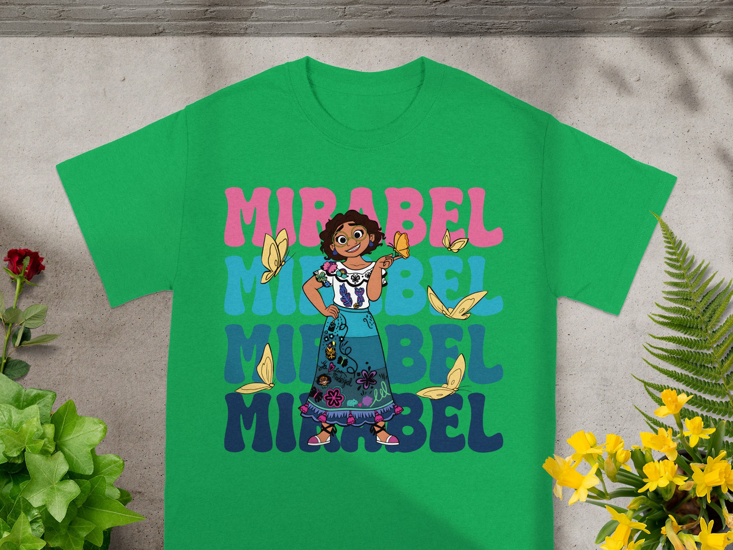 Mirabel from Encanto t-shirt with butterflies and colorful text.