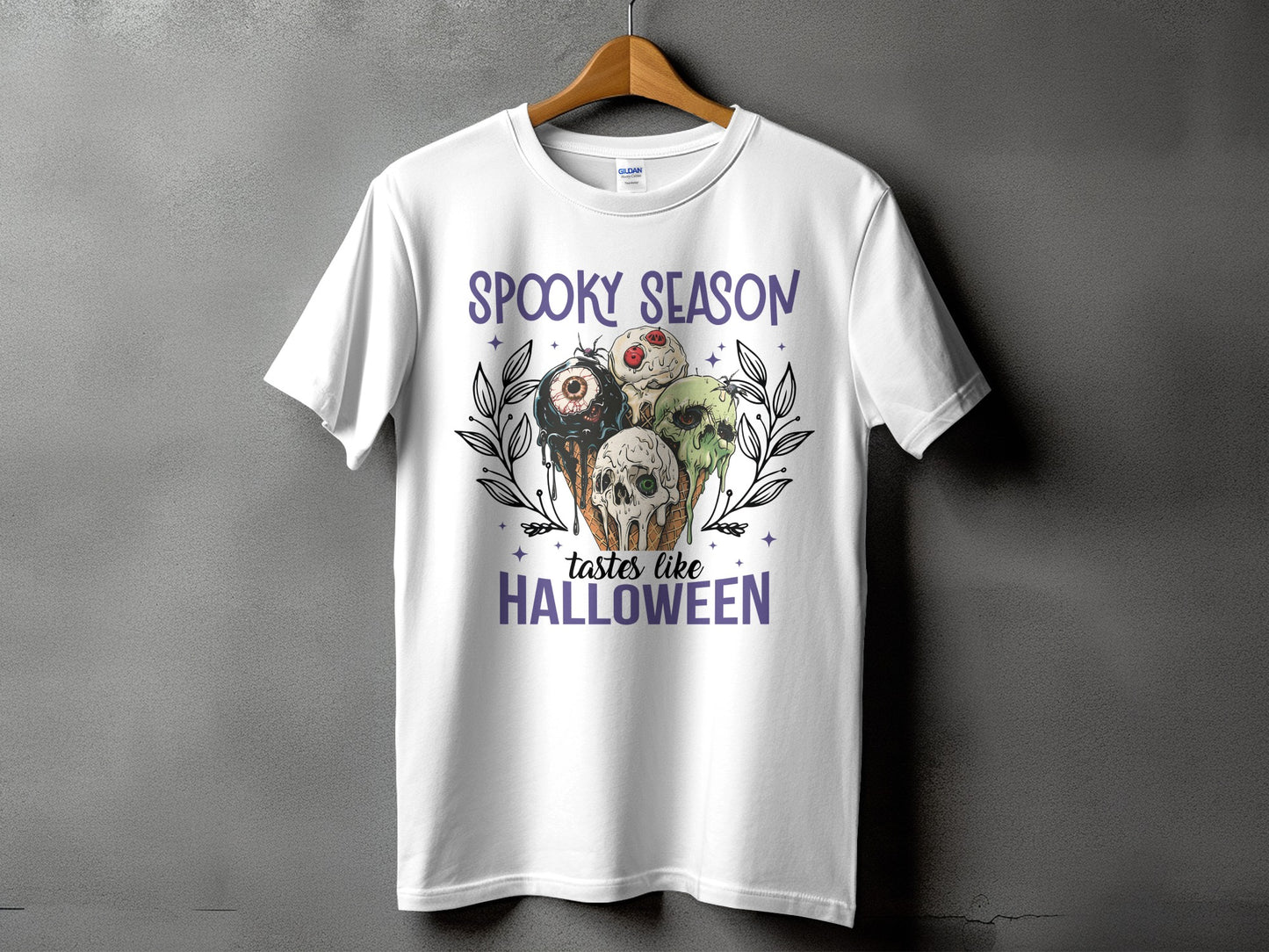 White t-shirt with spooky Halloween ice cream cones and text.