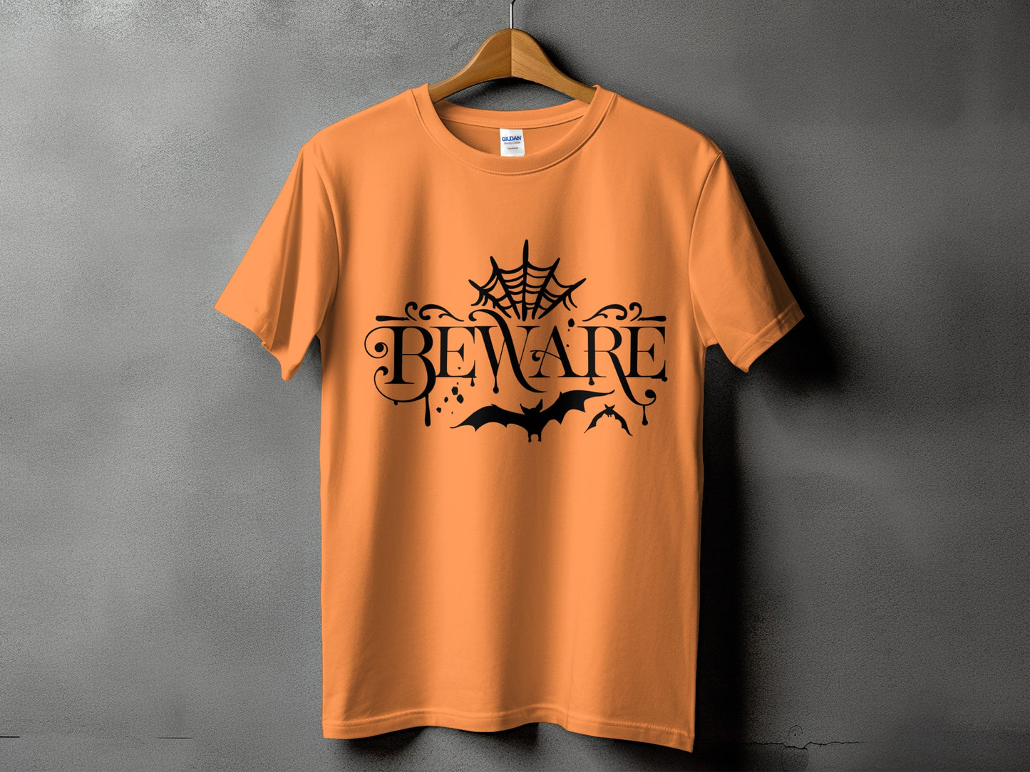 Orange t-shirt with black "BEWARE" text, spiderweb, and bats.