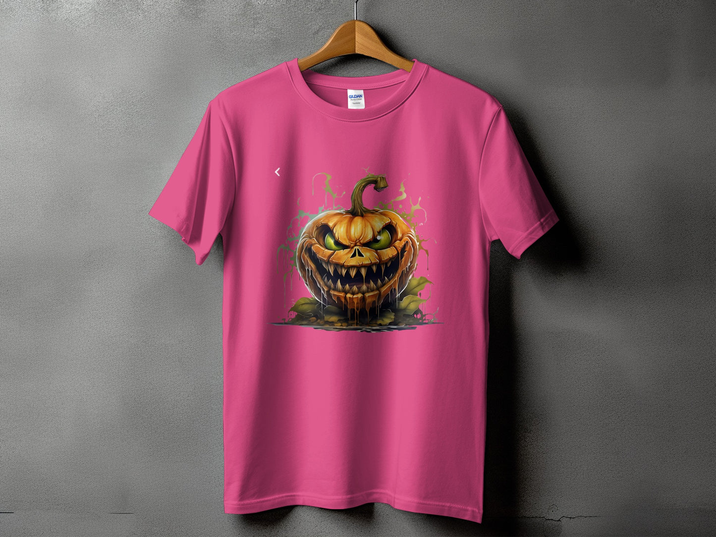 Pink t-shirt with a scary, dripping jack-o'-lantern graphic.