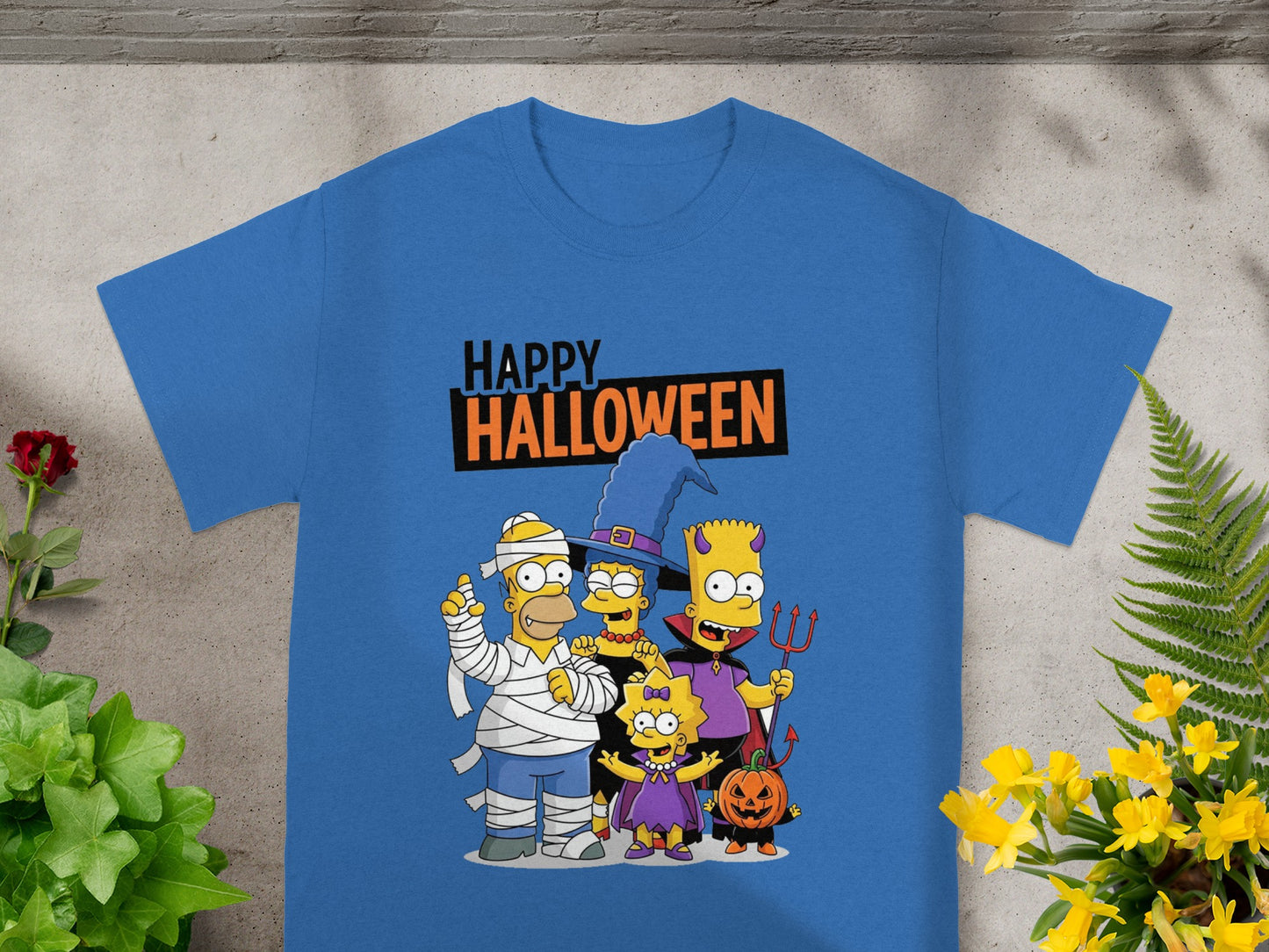 The Simpsons family dressed in Halloween costumes on a blue t-shirt with text.