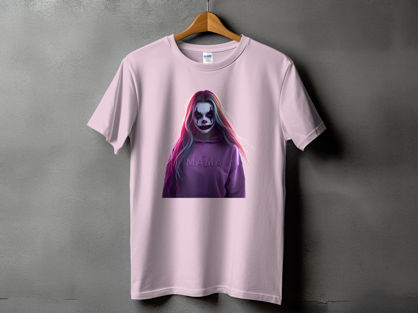 Pink t-shirt with graphic of person with clown makeup and "MAMA" text.