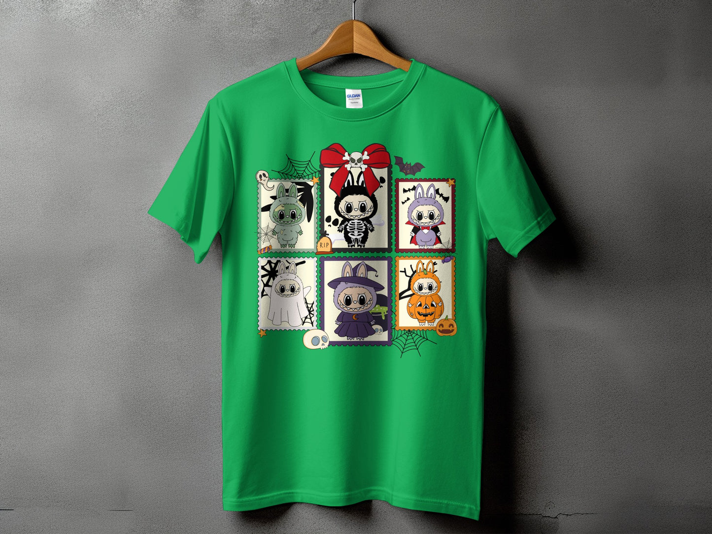 Green t-shirt with Halloween-themed cartoon characters in stamp frames.