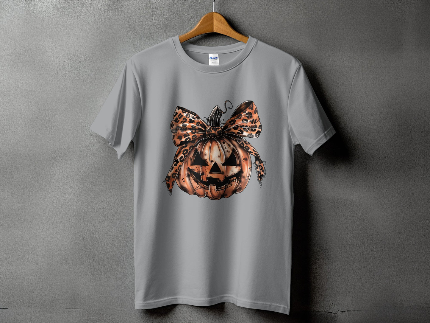 Gray t-shirt with a Halloween pumpkin and leopard print bow graphic.