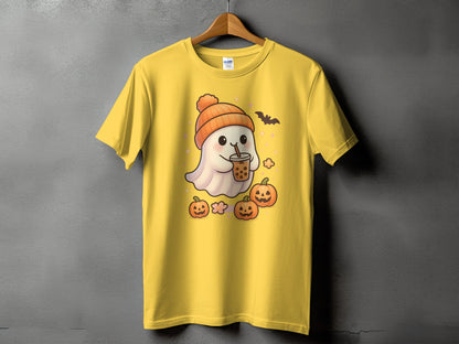 Yellow t-shirt with a kawaii ghost wearing a beanie, holding boba, and surrounded by pumpkins.