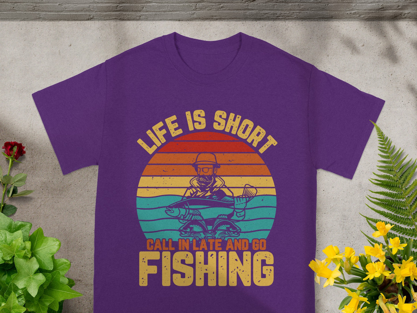 Purple t-shirt with "Life is Short Call In Late And Go Fishing" graphic.