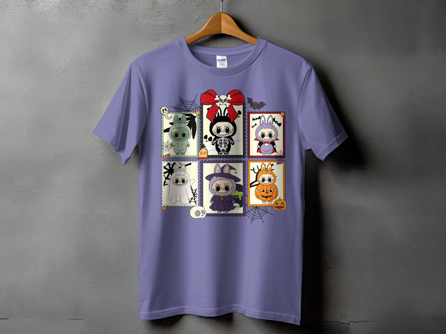 Purple t-shirt with six Halloween-themed stamp designs featuring cute characters.