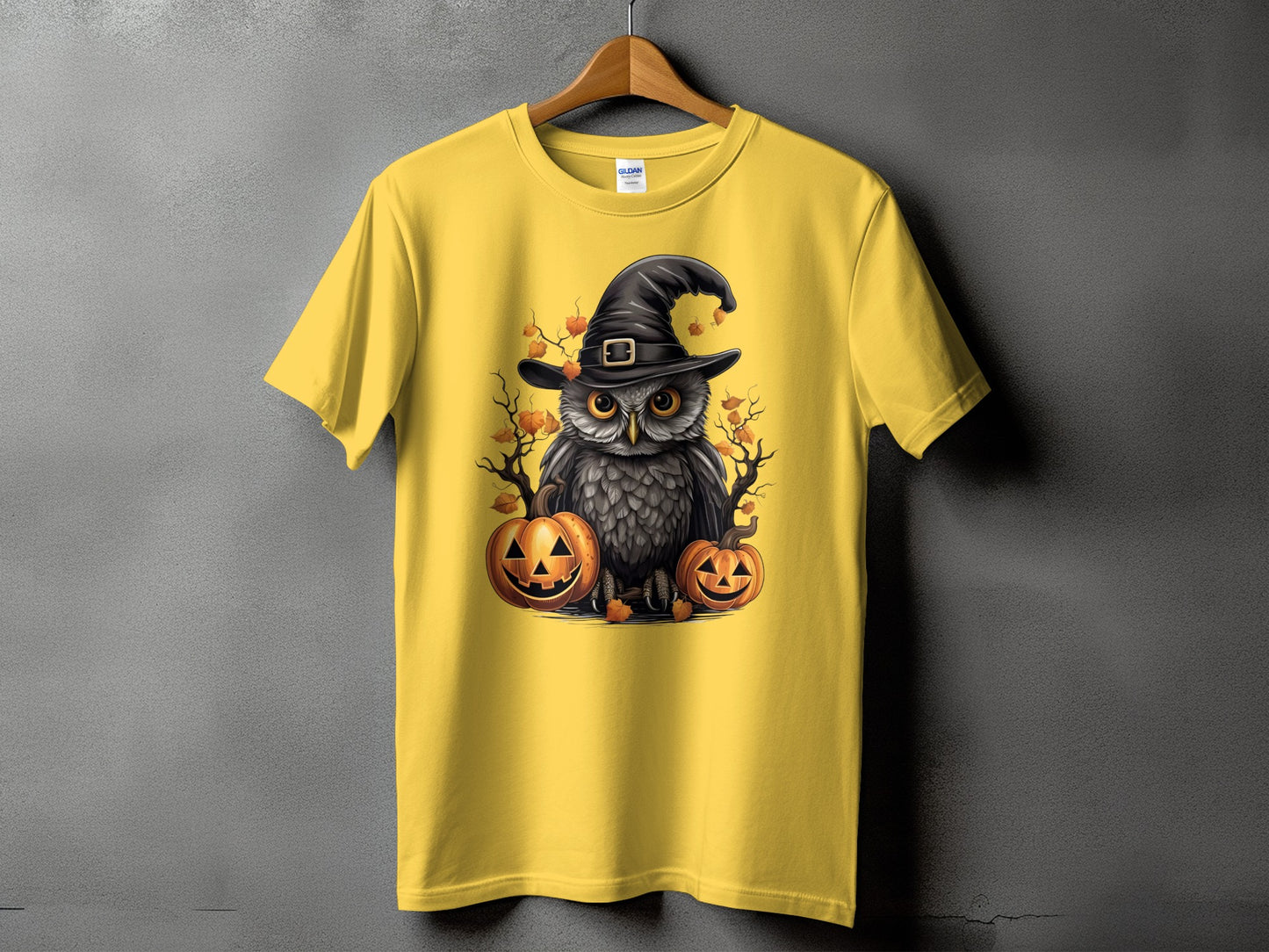 Yellow t-shirt with Halloween owl graphic and two jack-o'-lanterns.