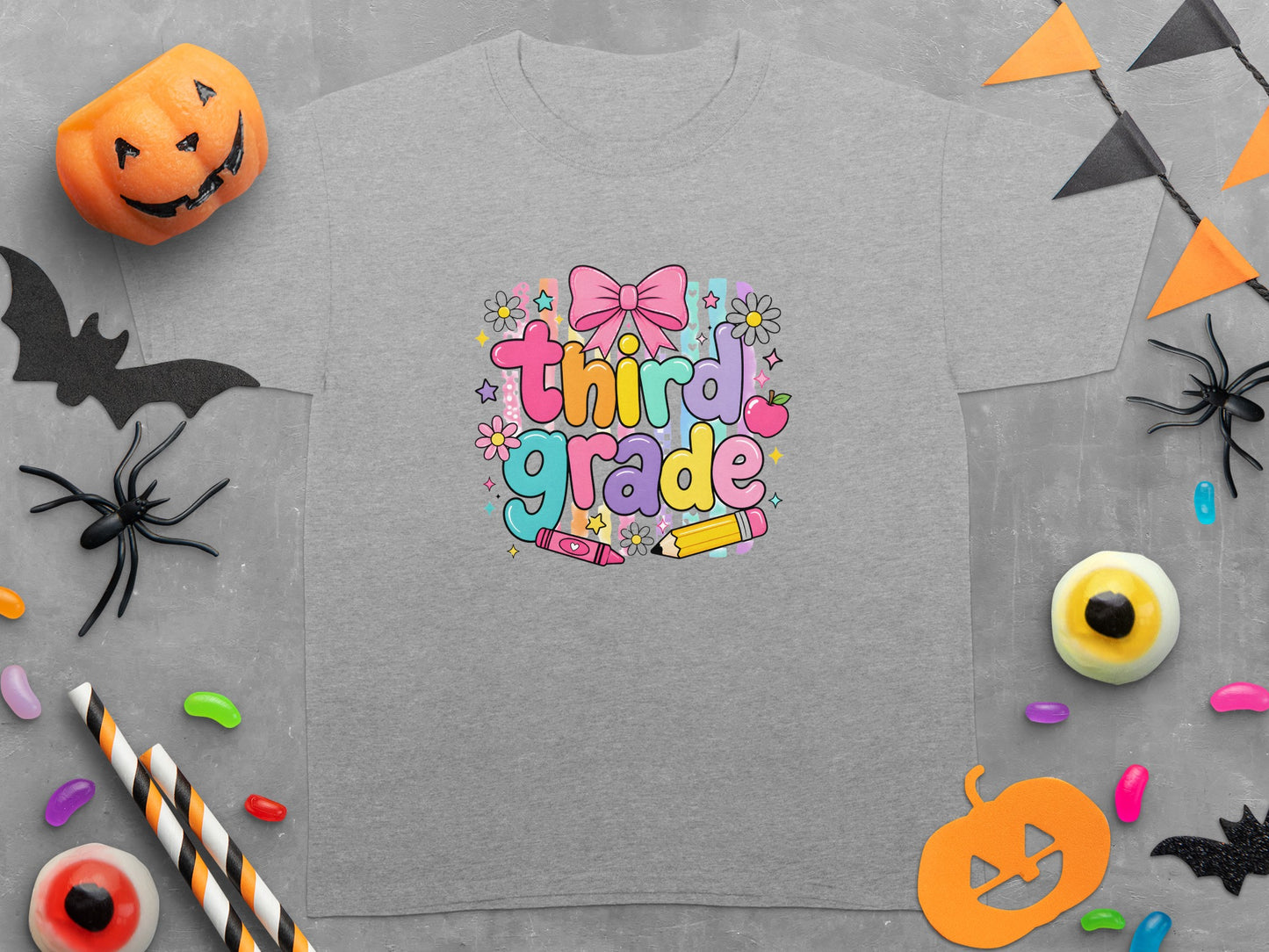 Gray t-shirt with "third grade" text and Halloween decorations.