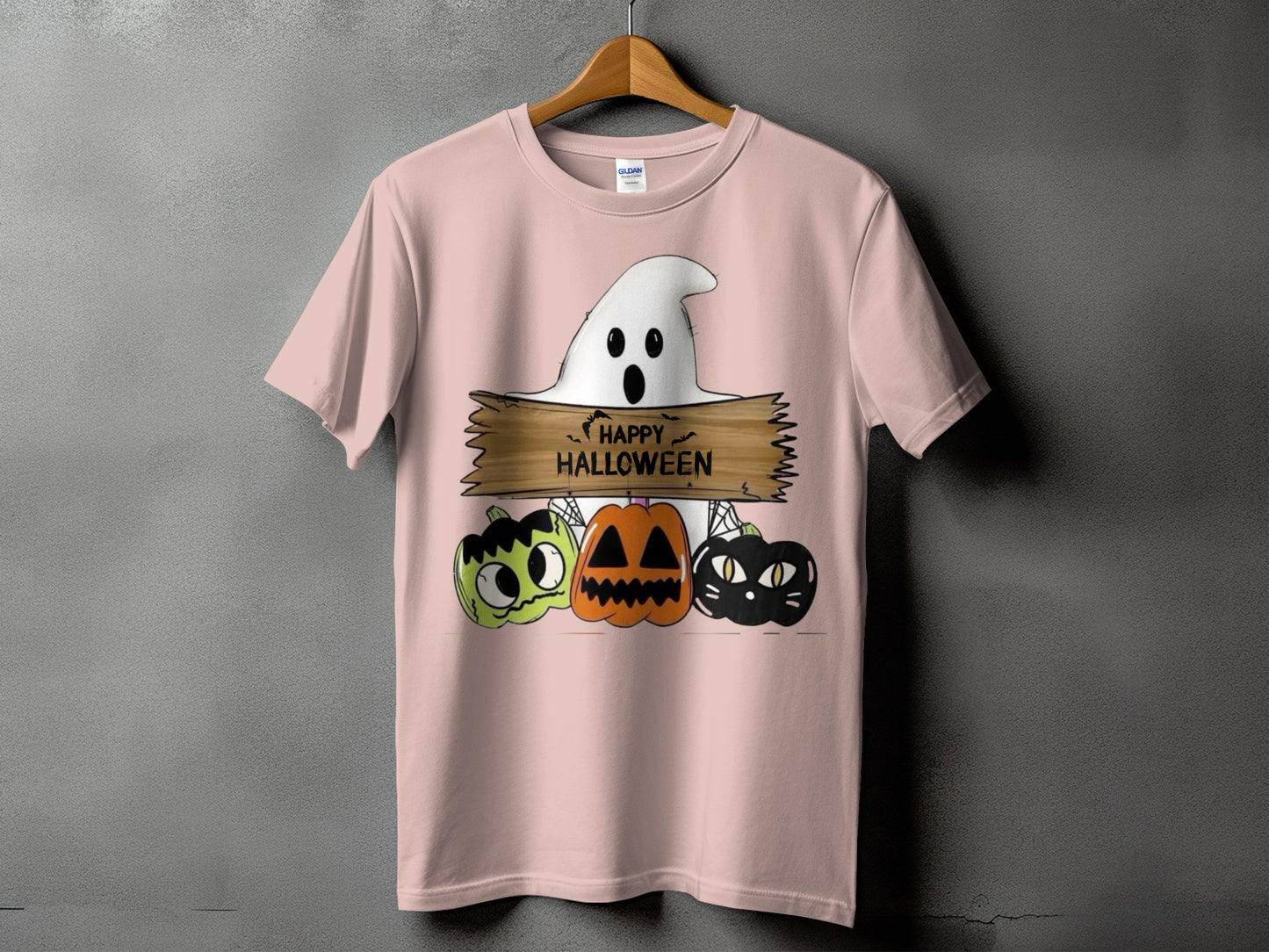 Pink t-shirt with ghost, pumpkins, and black cat graphic saying "Happy Halloween".