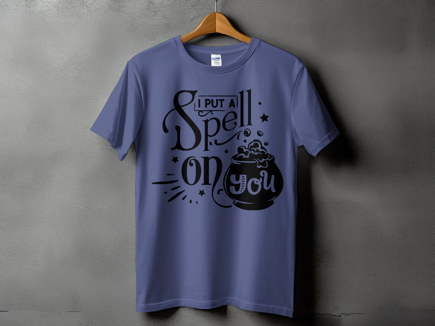 Purple t-shirt with "I Put A Spell On You" text and cauldron graphic.