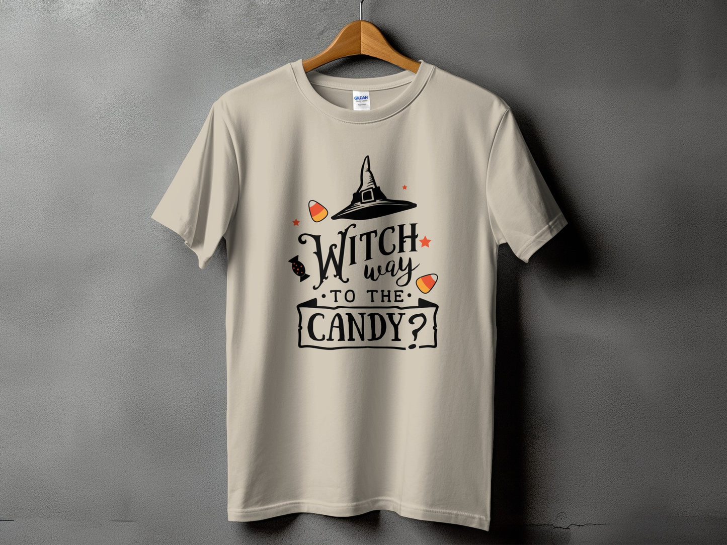 T-shirt with "Witch way to the candy?" Halloween graphic and candy corn accents.