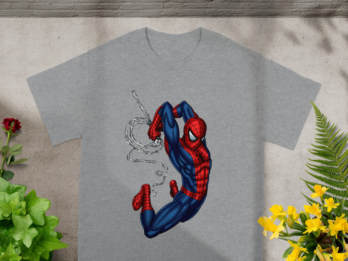 Gray t-shirt with Spider-Man swinging on a web.
