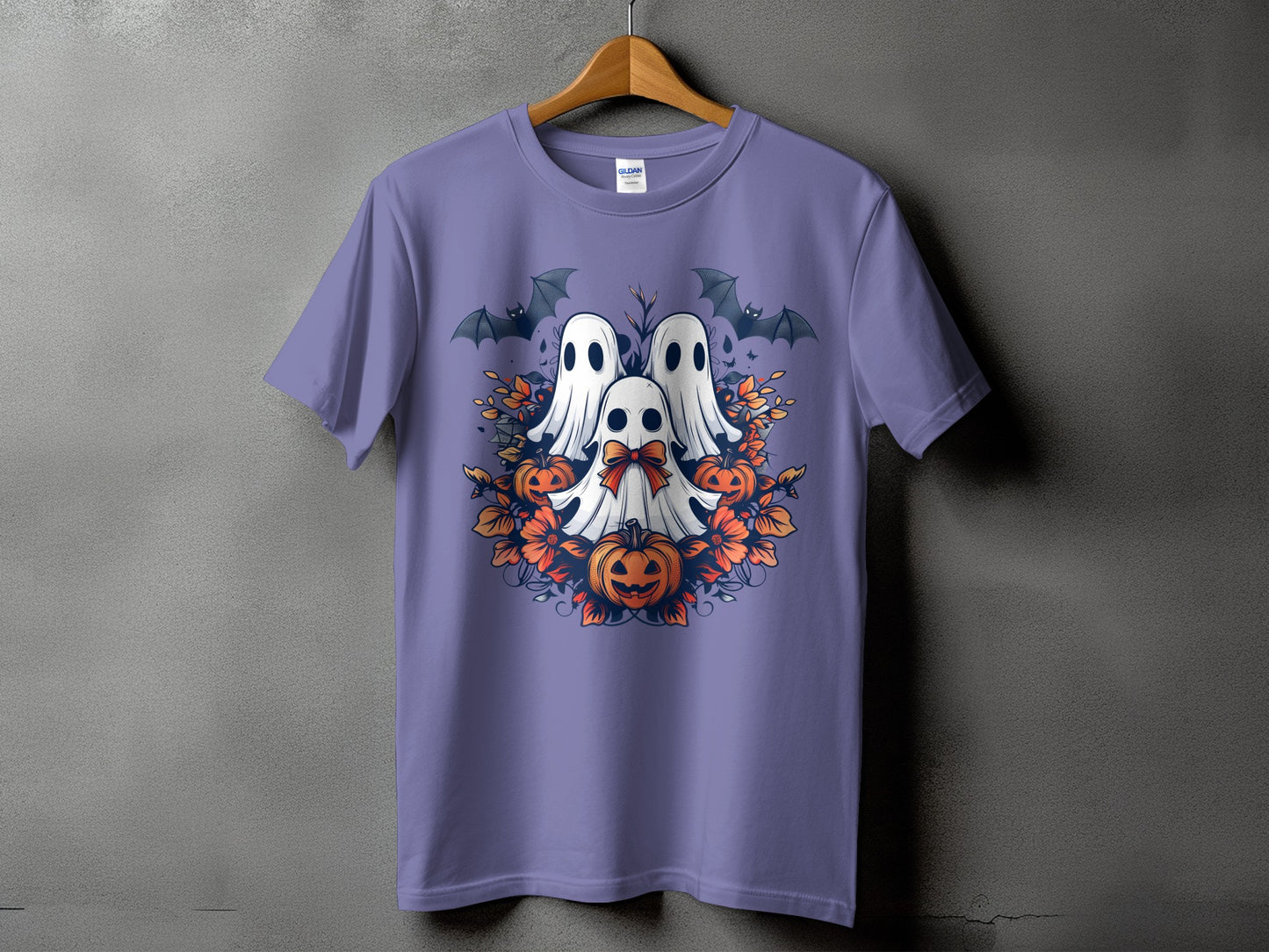Halloween t-shirt with three ghosts, bats, pumpkins, and floral accents.