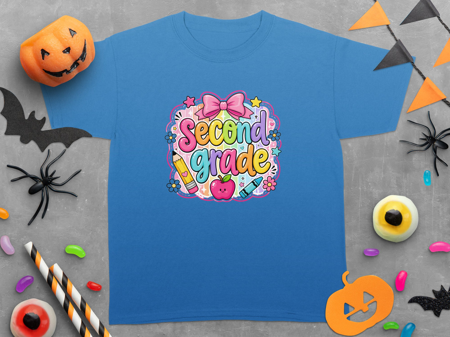 Blue t-shirt with "Second Grade" text, rainbow colors, and school supplies.
